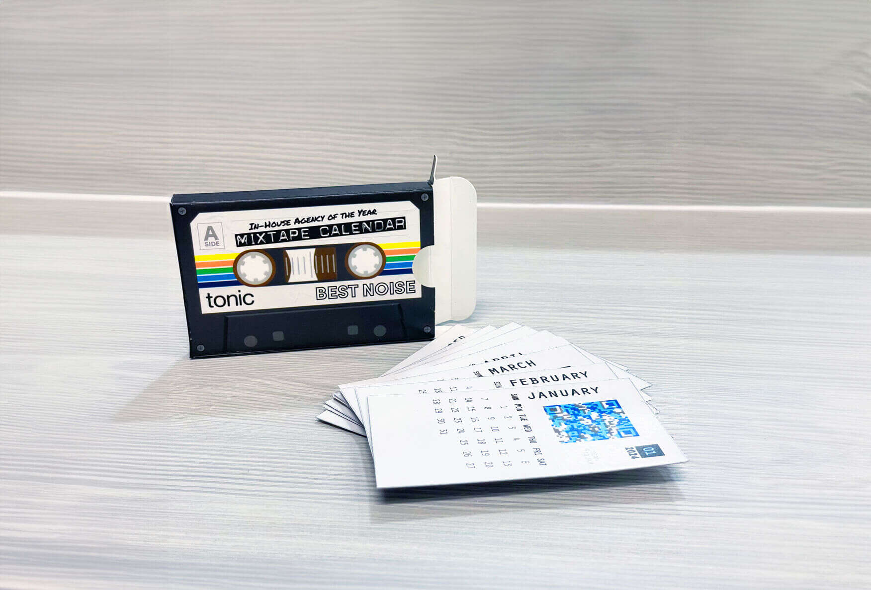Cassette-themed desktop calendar titled "Mixtape Calendar" with monthly pages spread out.