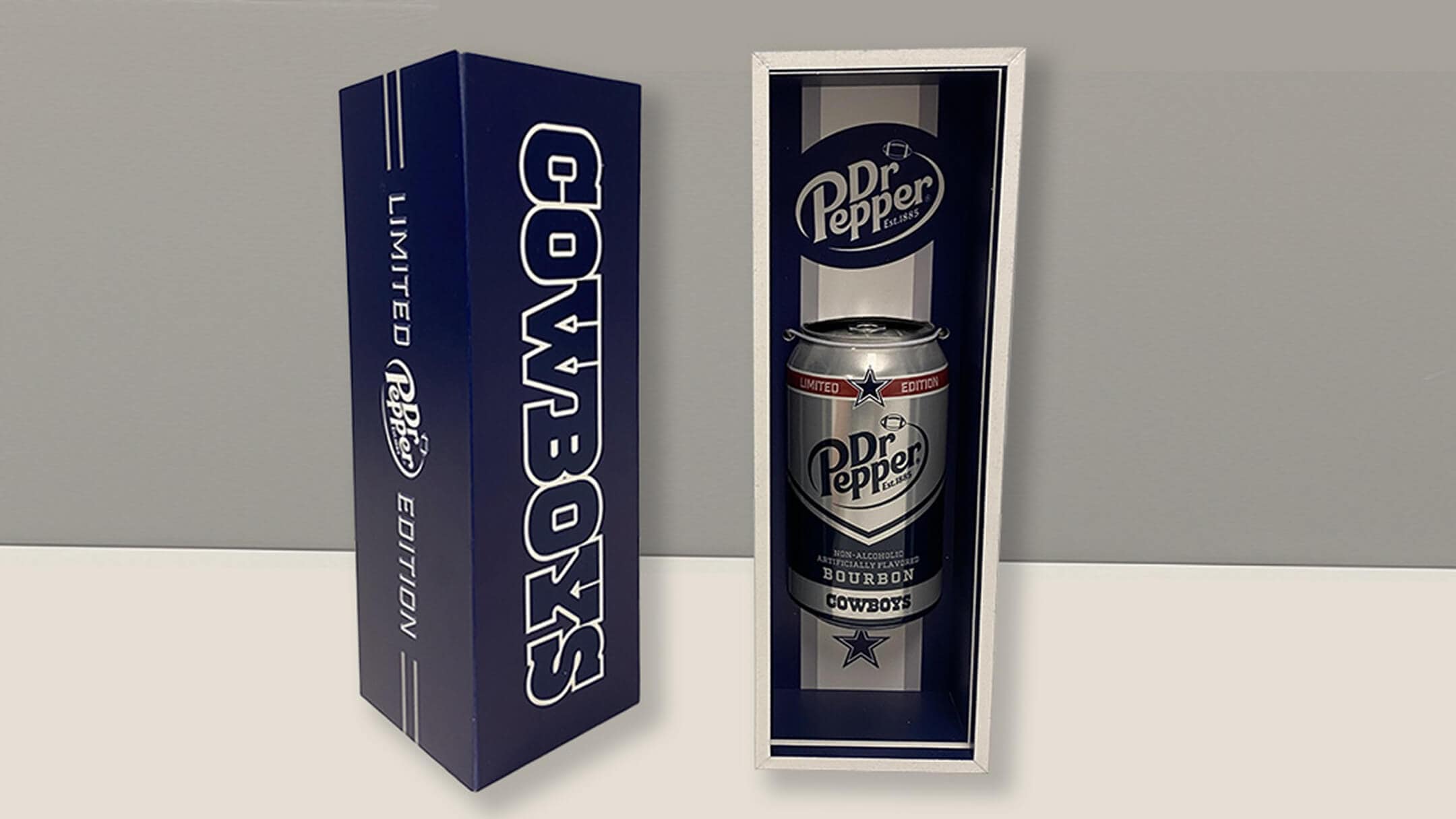 Interior of a limited-edition Dr Pepper box featuring a can of non-alcoholic bourbon-flavored soda co-branded with the Dallas Cowboys, alongside a message printed on the box flap.