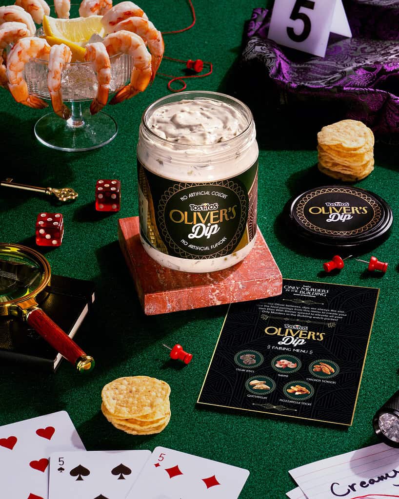 OLIVER'S DIP with shrimp and lemon garnishes on a festive table.