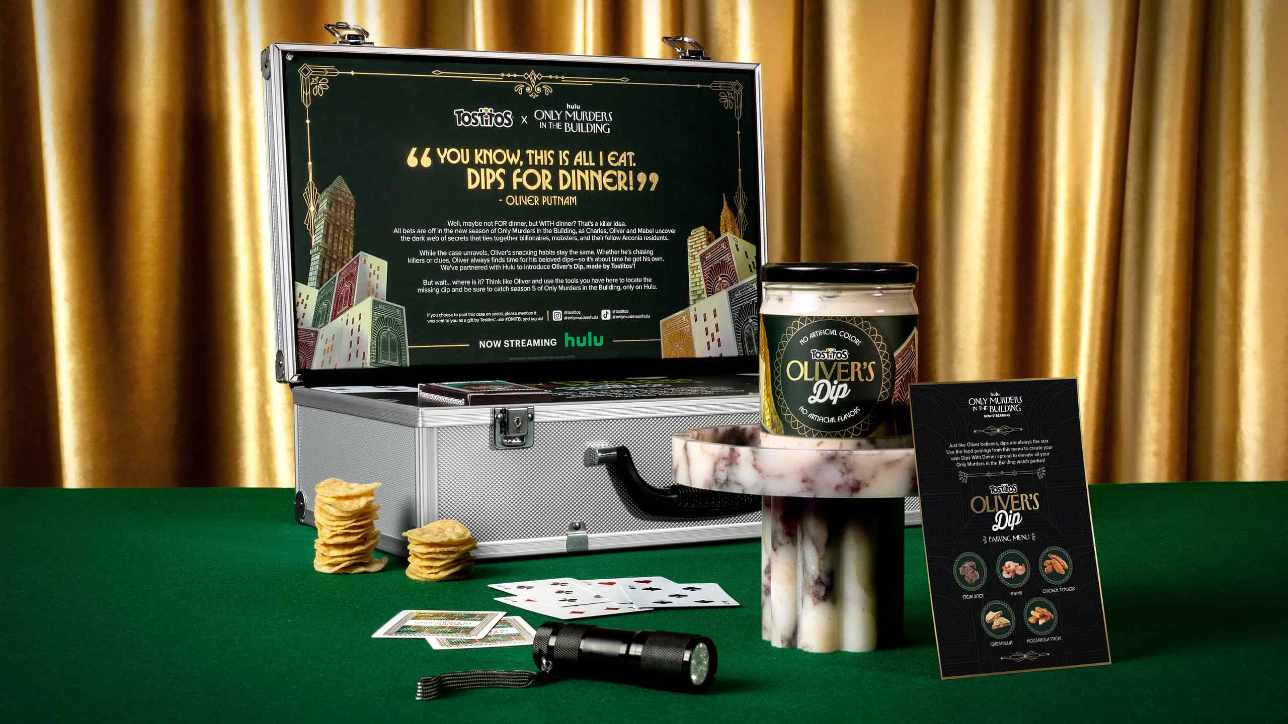 Promotional display for Tostitos and Hulu's "Only Murders in the Building" featuring dips and game accessories.